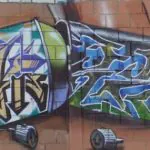 wall cans scaled - Meeting of Styles: International Street Art & Graffiti